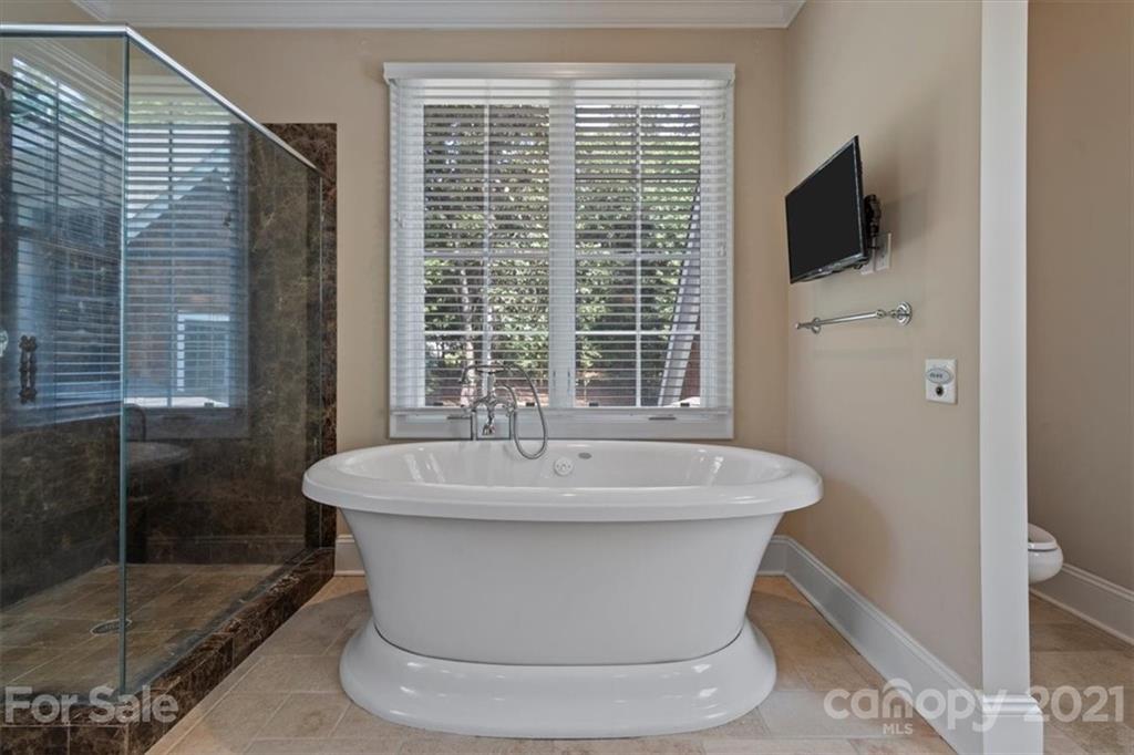 851 Stratford Run Drive Fort Mill, SC 29708 - Photo 26 of 48 a white bath tub sitting in a bathroom