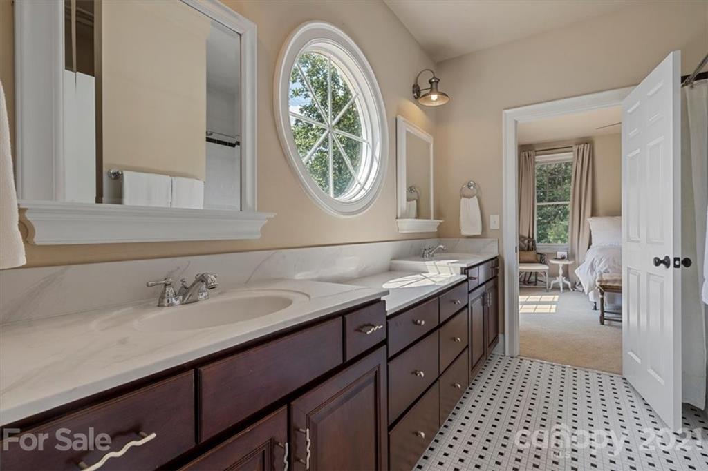 851 Stratford Run Drive Fort Mill, SC 29708 - Photo 28 of 48 a spacious bathroom with a granite countertop double vanity sink a mirror and a