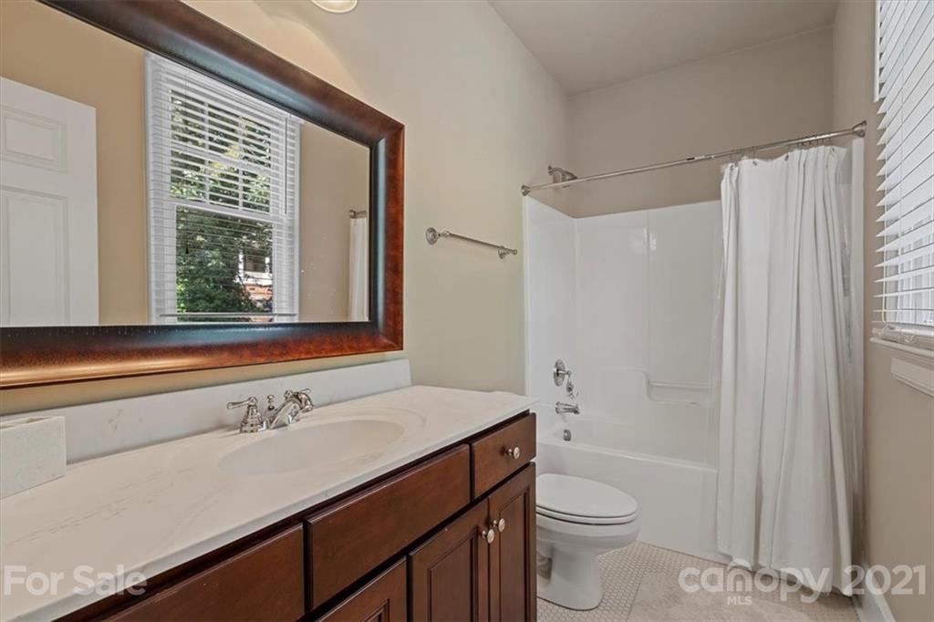 851 Stratford Run Drive Fort Mill, SC 29708 - Photo 31 of 48 a bathroom with a sink a toilet and a large mirror