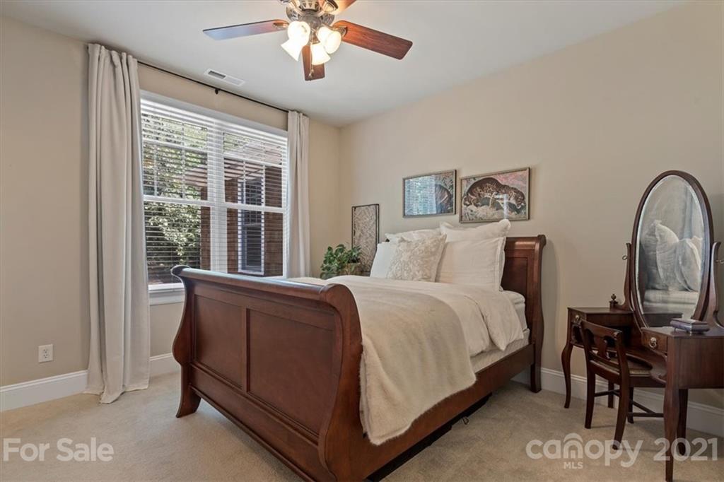 851 Stratford Run Drive Fort Mill, SC 29708 - Photo 32 of 48 a bed room with a bed and a chair