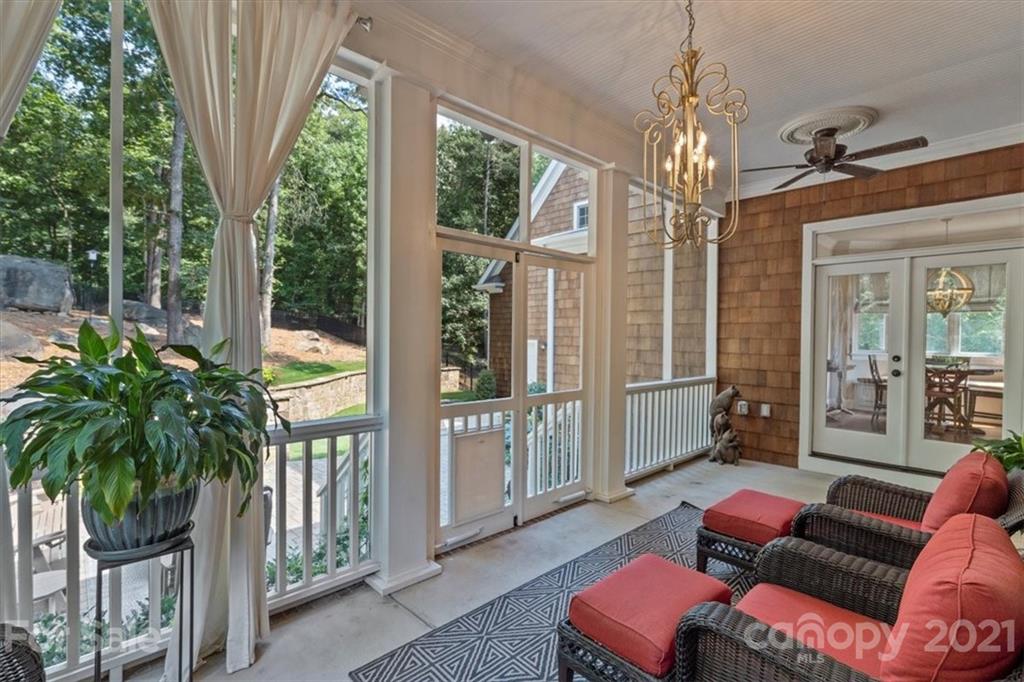 851 Stratford Run Drive Fort Mill, SC 29708 - Photo 38 of 48 a living room filled with furniture and a chandelier