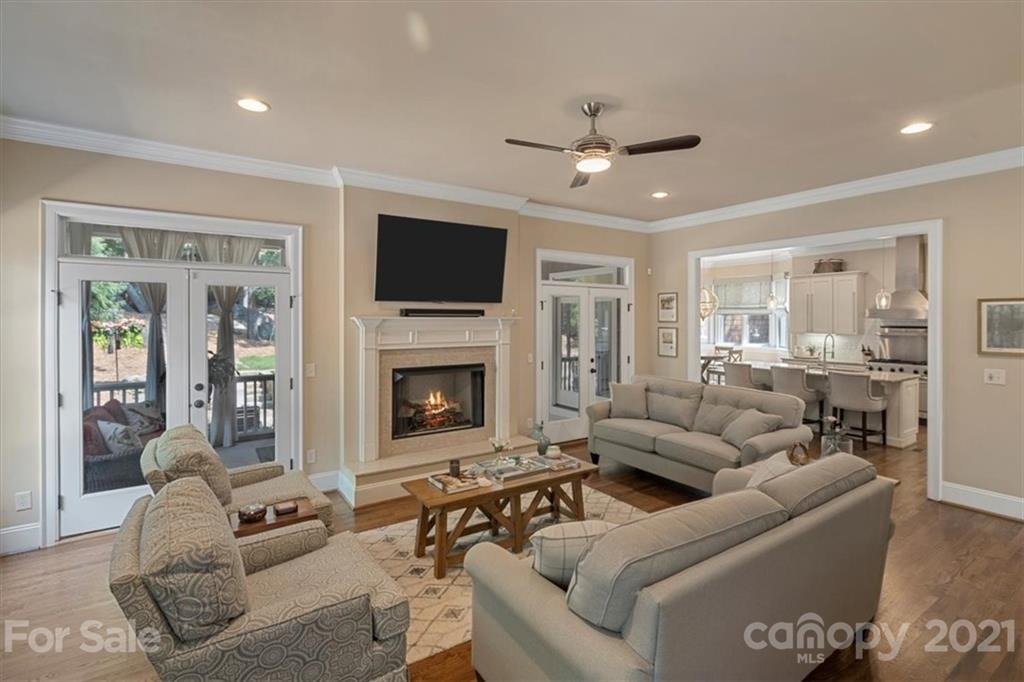 851 Stratford Run Drive Fort Mill, SC 29708 - Photo 7 of 48 a living room with furniture a flat screen tv and a fireplace
