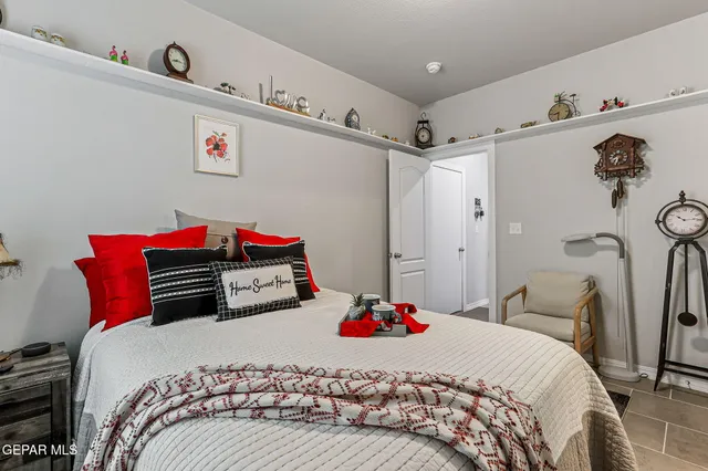 a bedroom with a bed and a dresser