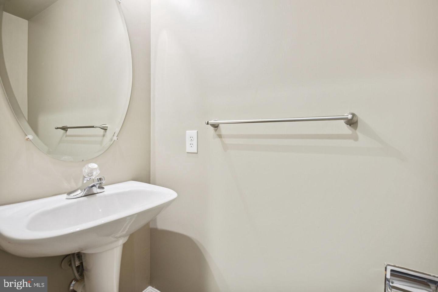 337 Main Street Gaithersburg, MD 20878 - Photo 20 of 35 a bathroom with a sink a mirror and a toilet