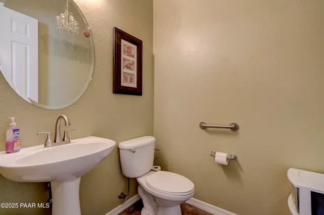 a kitchen with stainless steel appliances granite countertop sink stove top oven and cabinets