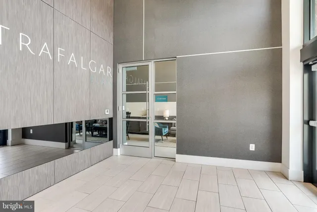 a view of an empty room with glass door