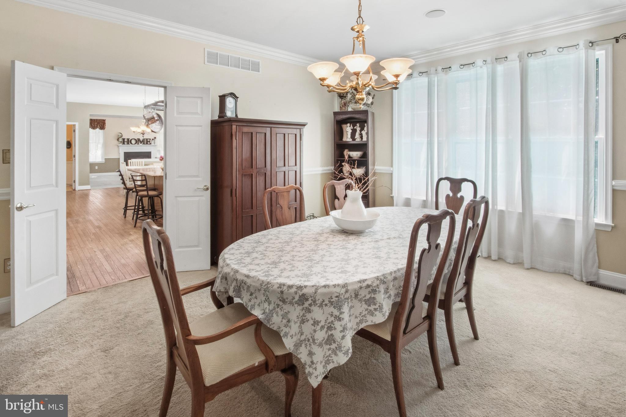15 Hollybrook Road Mullica Hill, NJ 08062 - Photo 10 of 38 a dining room with furniture and chandelier