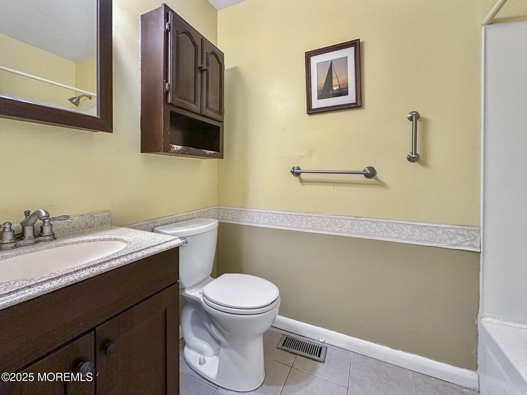 192 Dolphin Road Manahawkin, NJ 08050 - Photo 11 of 25 a bathroom with a granite countertop toilet sink and mirror