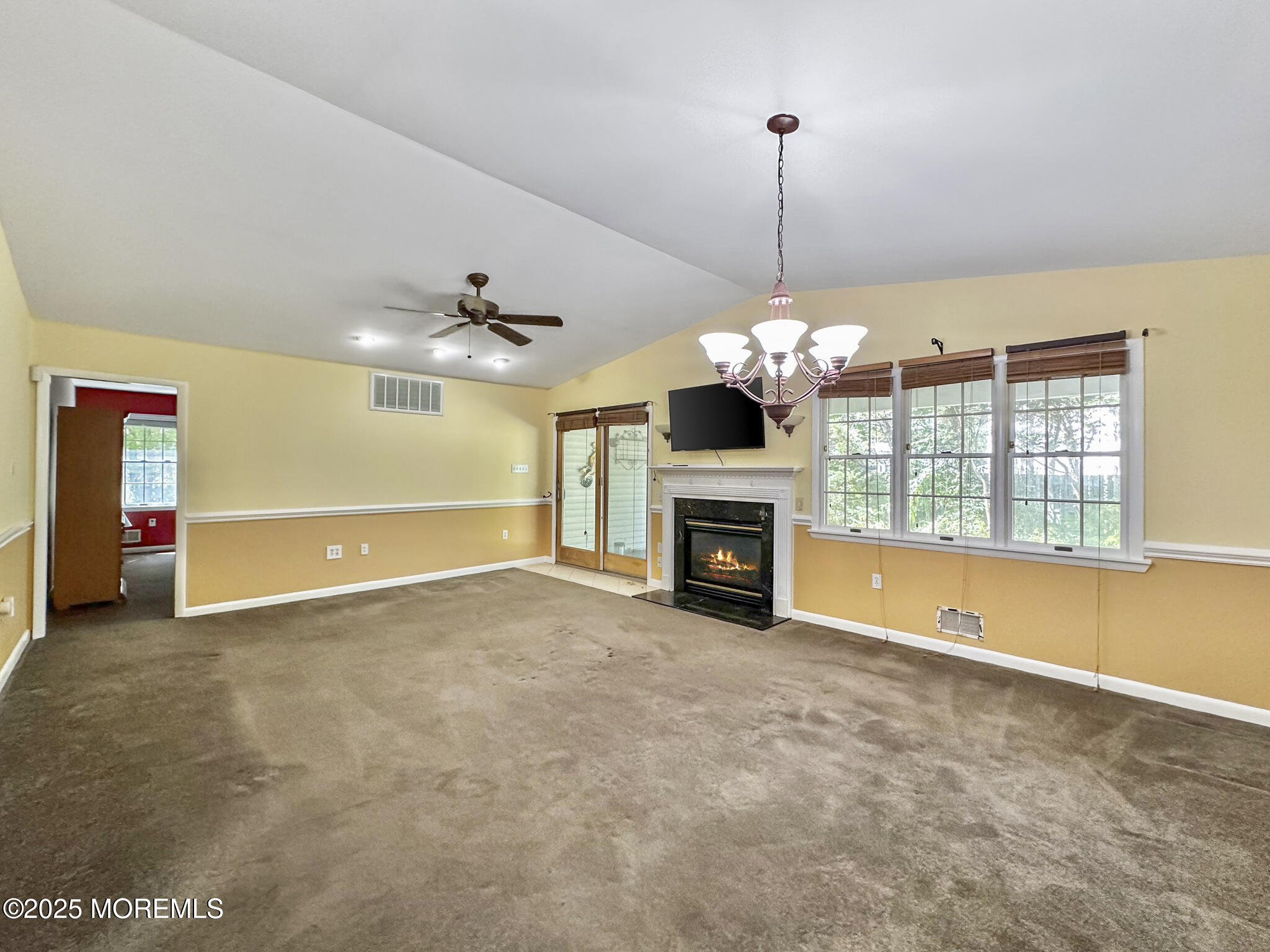 192 Dolphin Road Manahawkin, NJ 08050 - Photo 15 of 25 a view of an empty room with a fireplace and a window