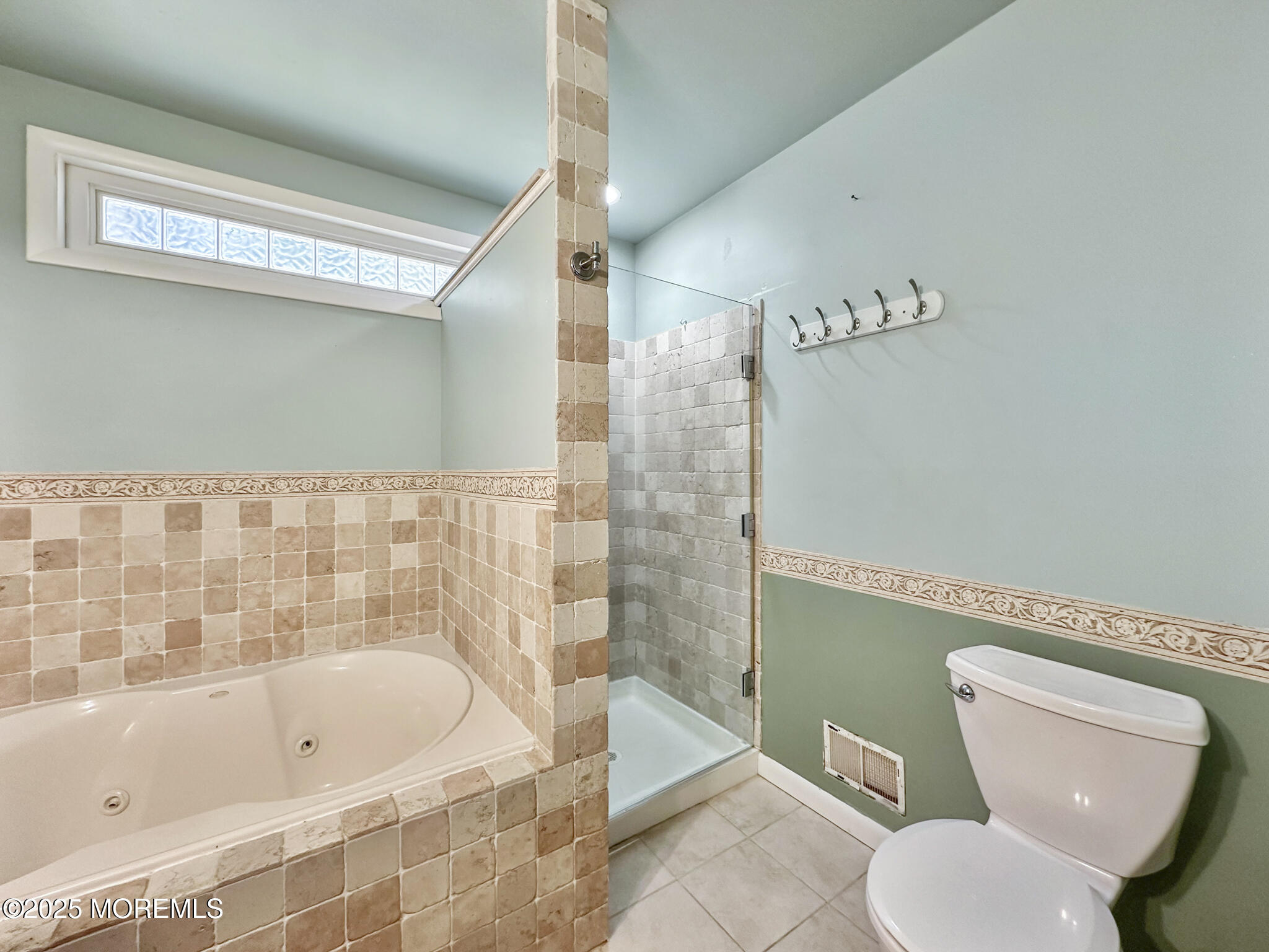 192 Dolphin Road Manahawkin, NJ 08050 - Photo 18 of 25 a bathroom with a toilet and a bathtub
