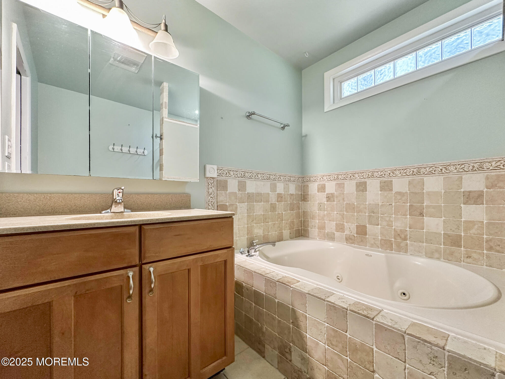 192 Dolphin Road Manahawkin, NJ 08050 - Photo 19 of 25 a bathroom with a bathtub and a sink