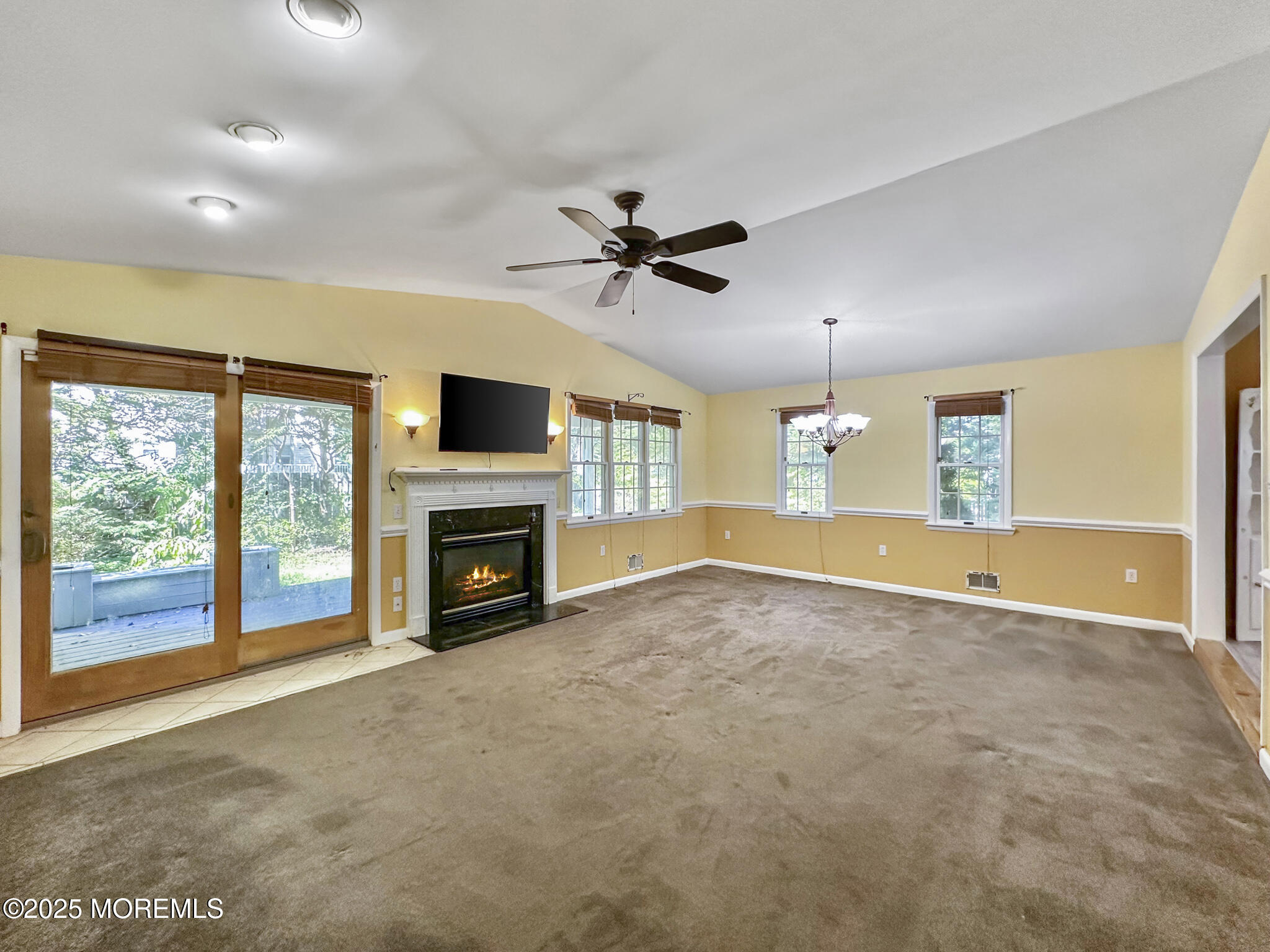 192 Dolphin Road Manahawkin, NJ 08050 - Photo 21 of 25 a view of an empty room with a fireplace and a window