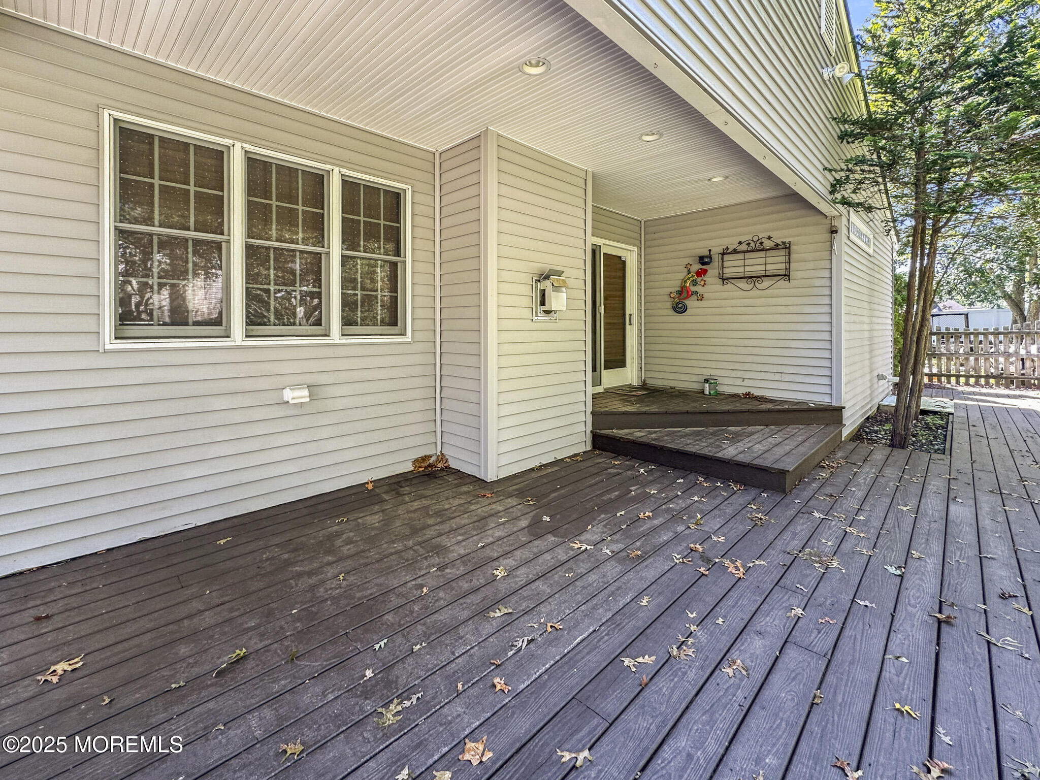 192 Dolphin Road Manahawkin, NJ 08050 - Photo 22 of 25 a view of a house with a deck