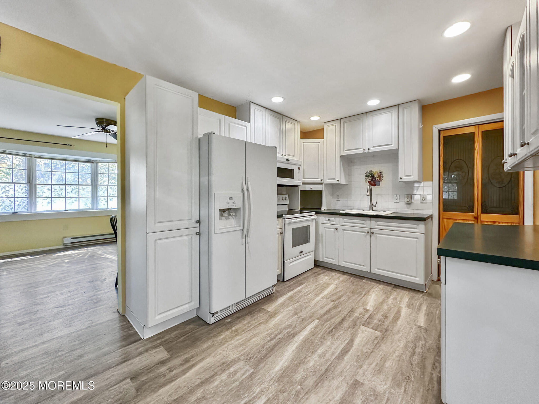 192 Dolphin Road Manahawkin, NJ 08050 - Photo 3 of 25 a kitchen with stainless steel appliances a refrigerator and microwave