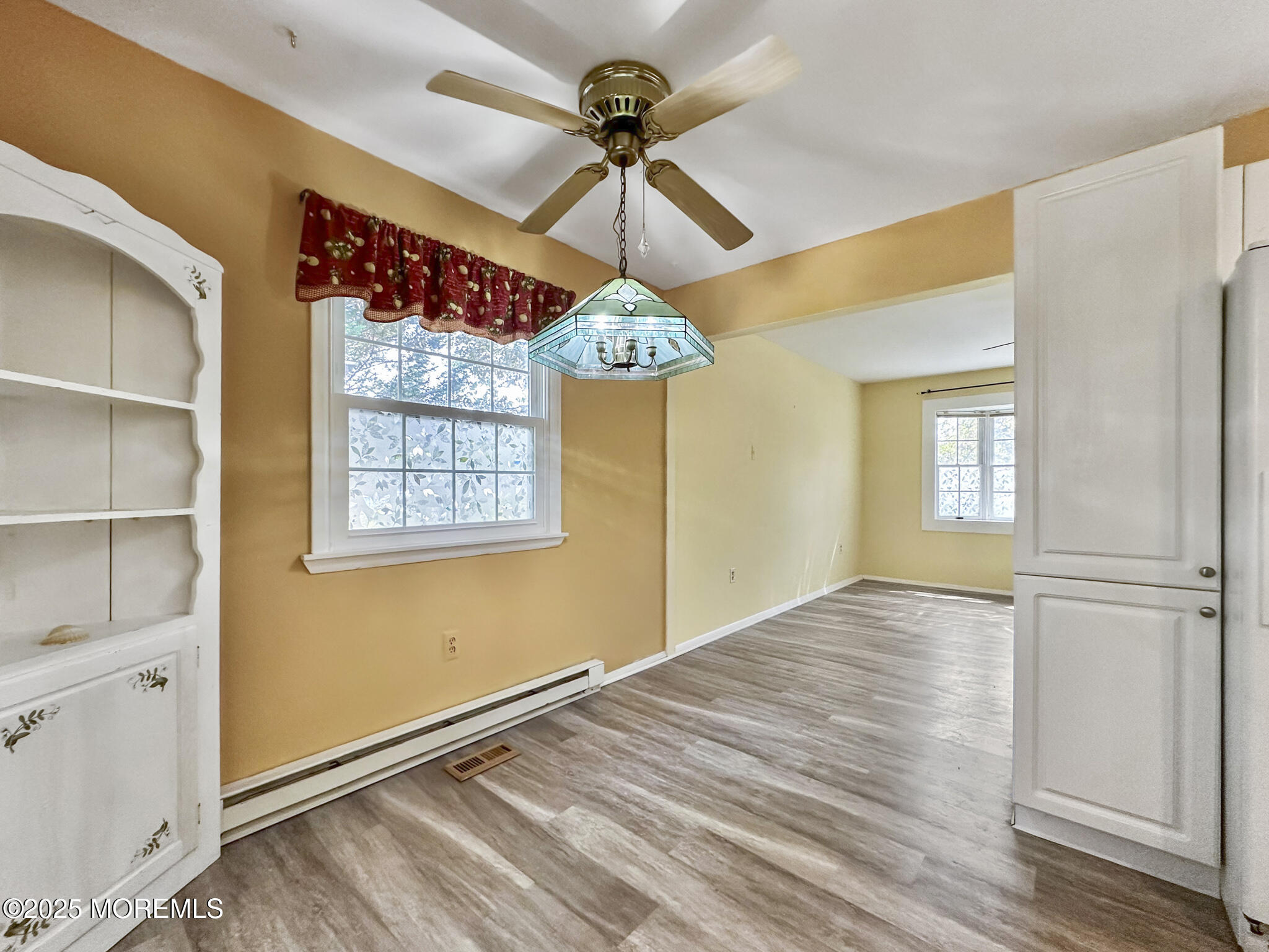 192 Dolphin Road Manahawkin, NJ 08050 - Photo 6 of 25 a view of a livingroom with a window and wooden floor