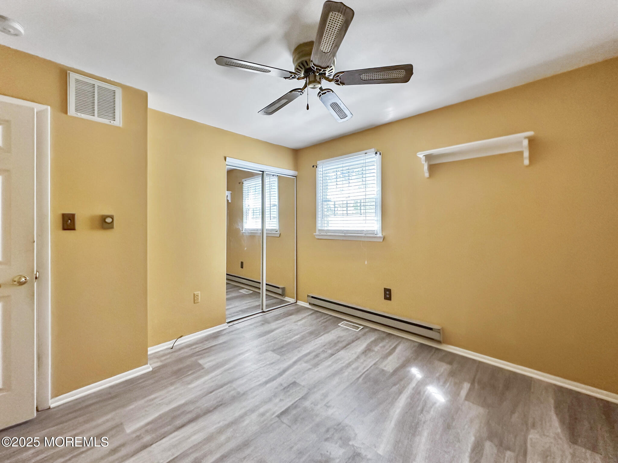 192 Dolphin Road Manahawkin, NJ 08050 - Photo 10 of 25 a view of room with window and ceiling fan