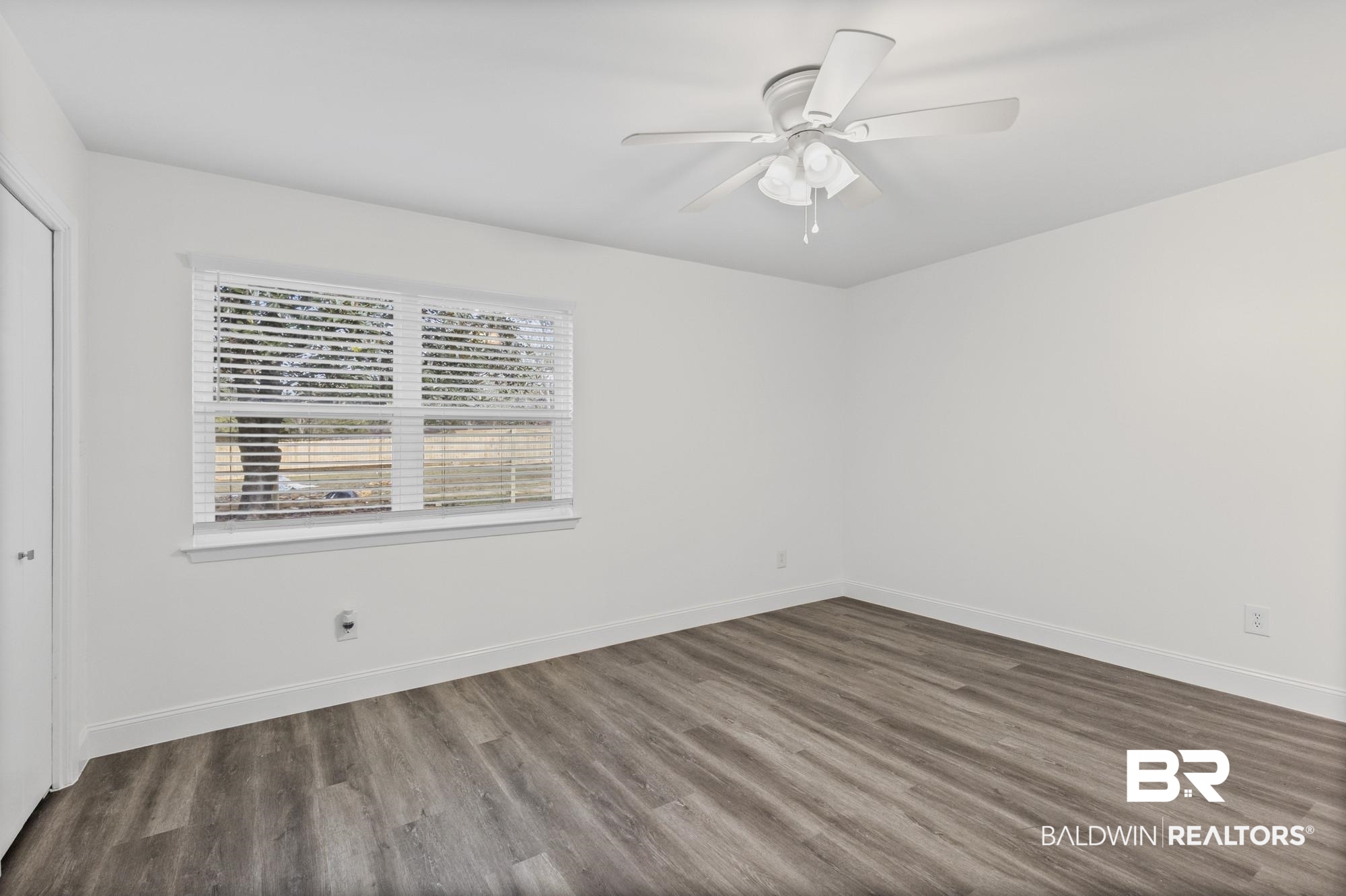3041 Pretty Branch Drive East Mobile, AL 36618 - Photo 12 of 20 Spare room with dark wood-style floors and a ceiling fan