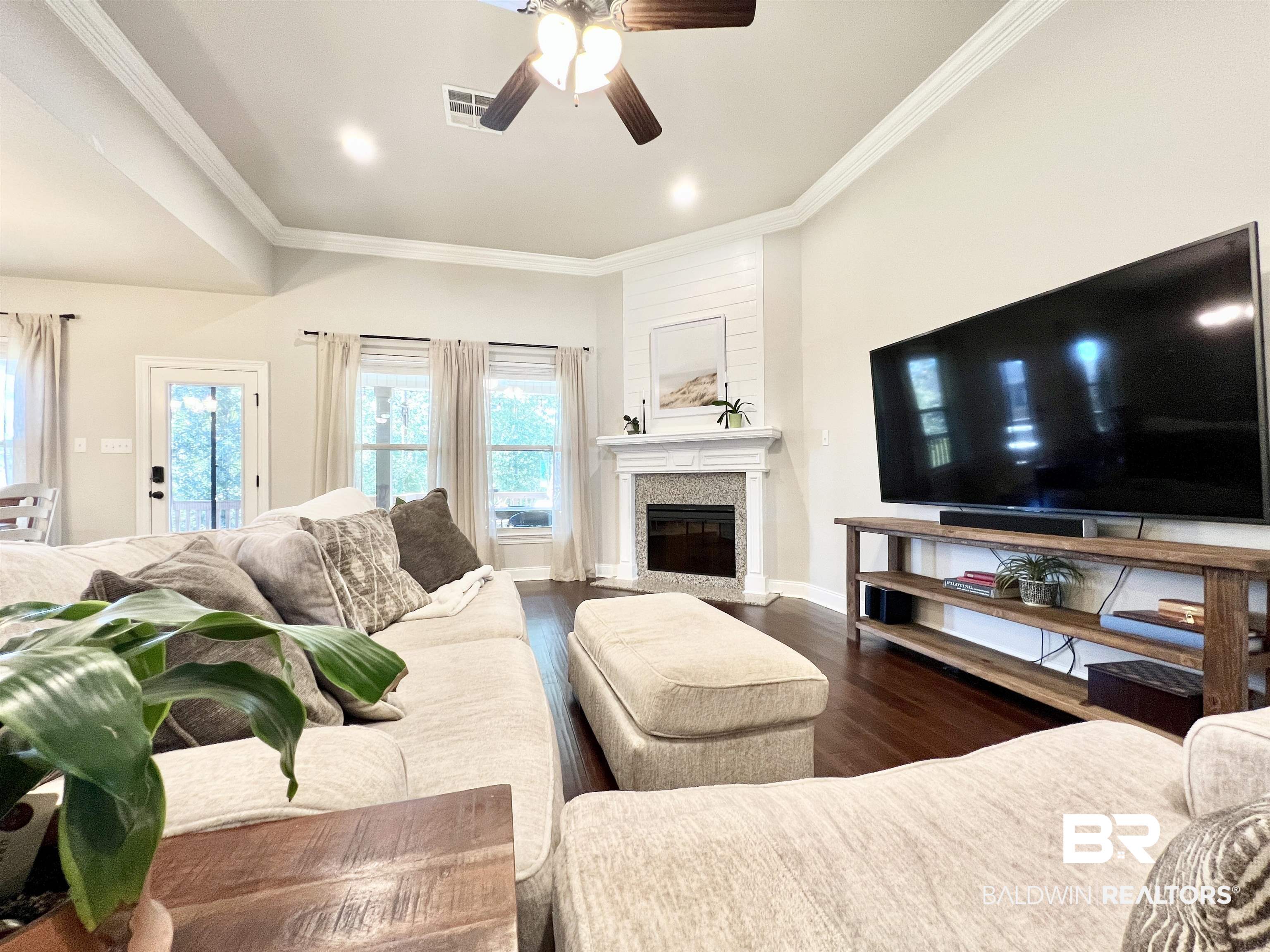 32290 Calder Court Daphne, AL 36527 - Photo 12 of 59 Living room with ornamental molding, dark wood-type flooring, and ceiling fan