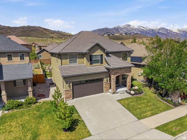 2007 Fielding Hill Lane Draper, UT 84020 - Photo 1 of 83 Two-story stucco residence featuring a stone-clad porch and a two-car garage