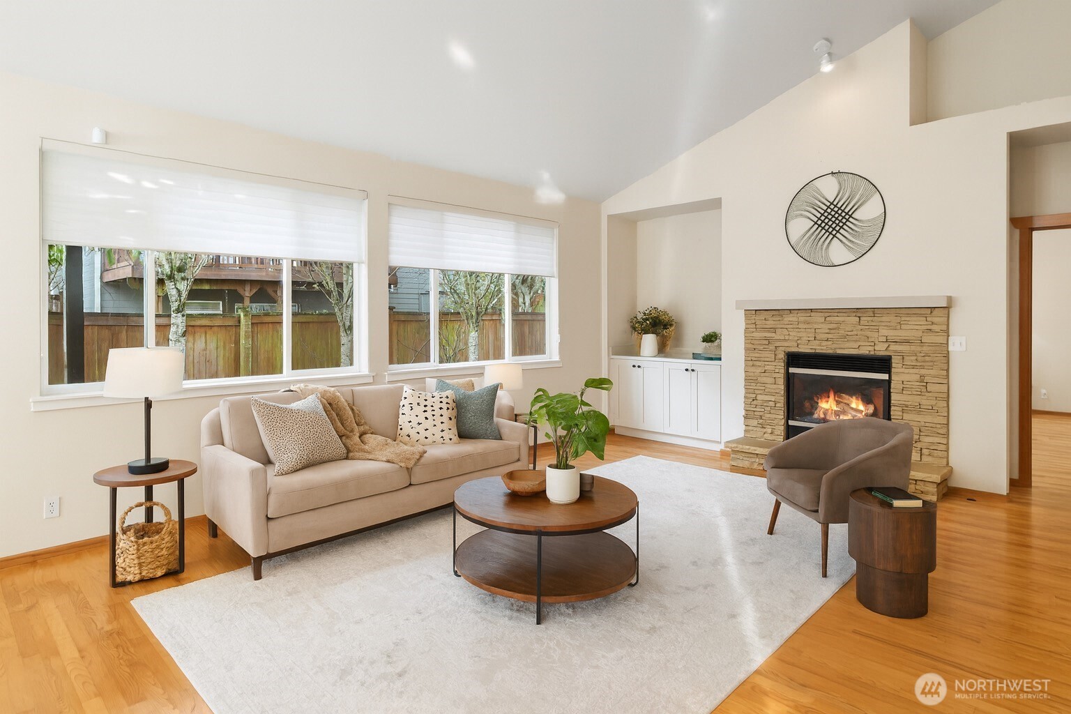 18130 Sunrise Ridge Avenue Northeast Poulsbo, WA 98370 - Photo 11 of 30 a living room with furniture and a fireplace