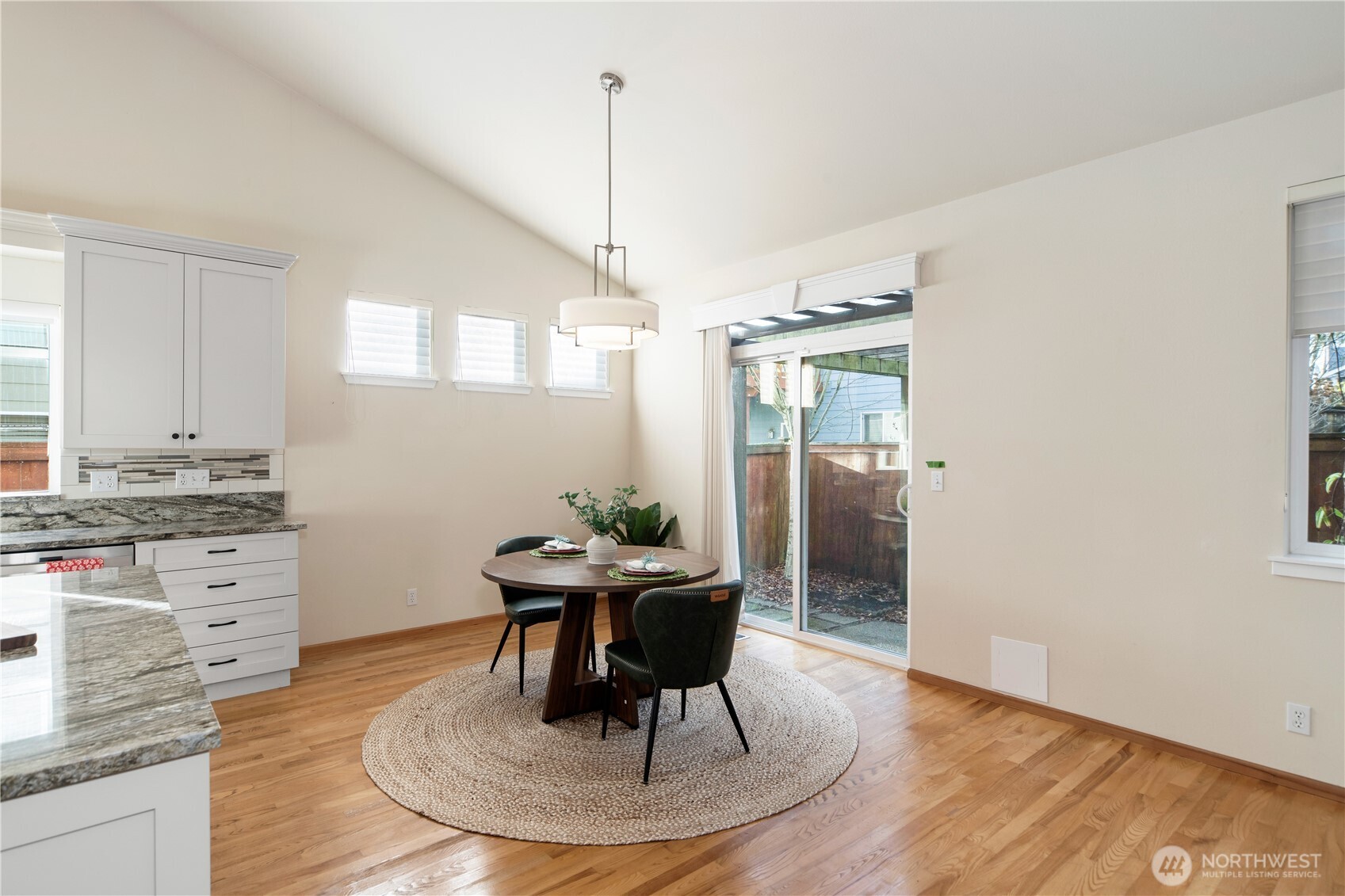18130 Sunrise Ridge Avenue Northeast Poulsbo, WA 98370 - Photo 16 of 30 a dining room with furniture and window