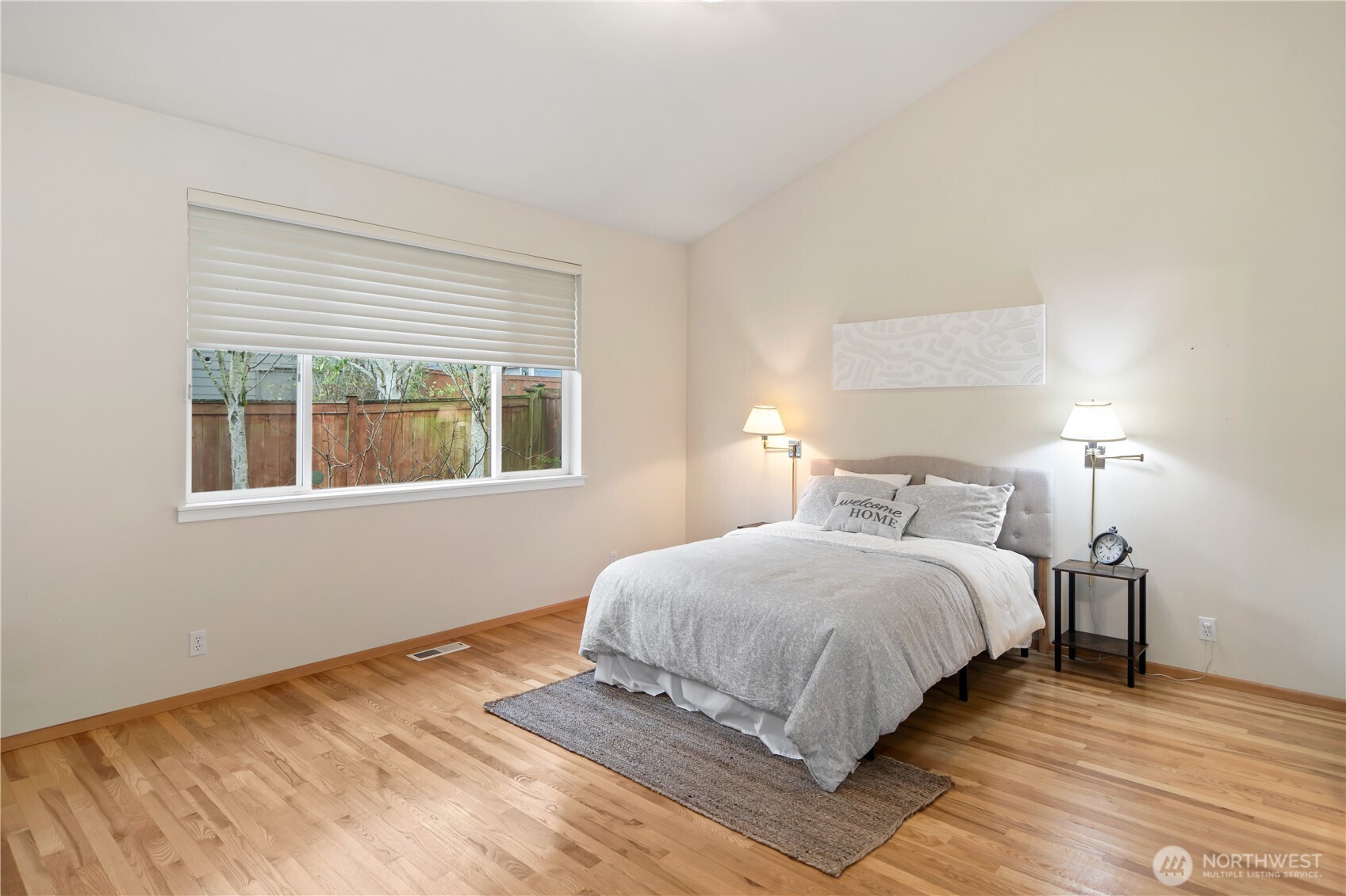 18130 Sunrise Ridge Avenue Northeast Poulsbo, WA 98370 - Photo 17 of 30 a bedroom with a bed and window