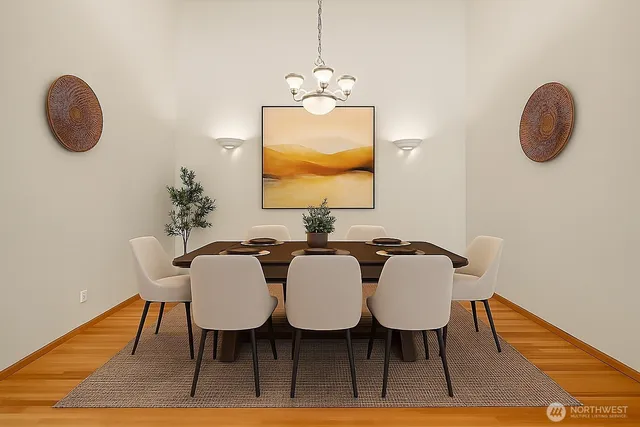 a view of a dining room with furniture and wooden floor