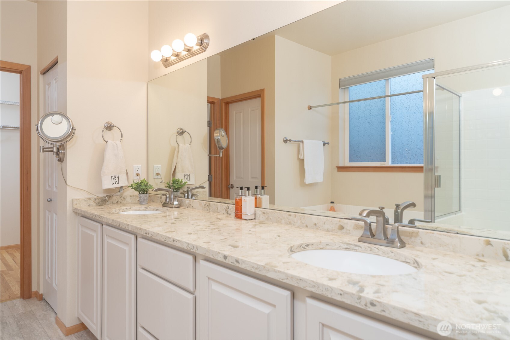 18130 Sunrise Ridge Avenue Northeast Poulsbo, WA 98370 - Photo 19 of 30 a bathroom with a granite countertop sink and a mirror