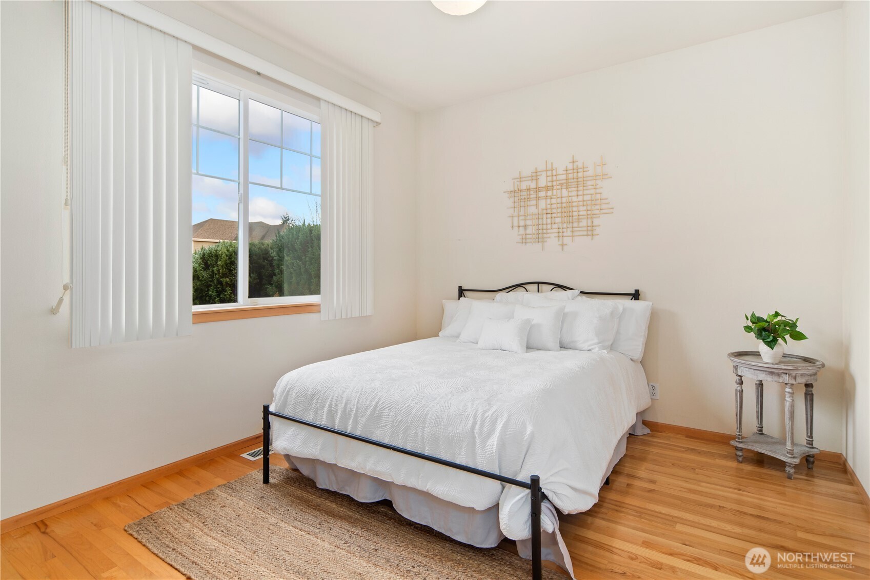 18130 Sunrise Ridge Avenue Northeast Poulsbo, WA 98370 - Photo 23 of 30 a bedroom with a bed table and window