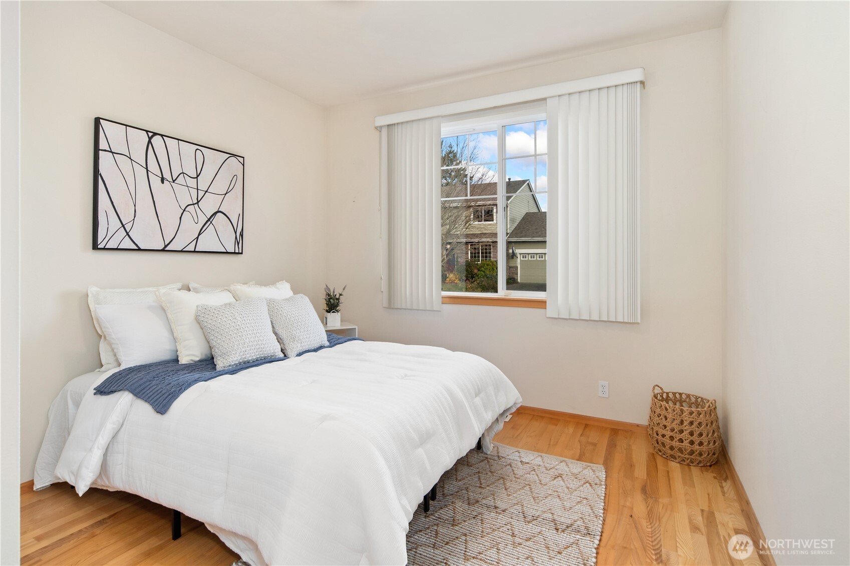 18130 Sunrise Ridge Avenue Northeast Poulsbo, WA 98370 - Photo 26 of 30 a bedroom with a bed and a window