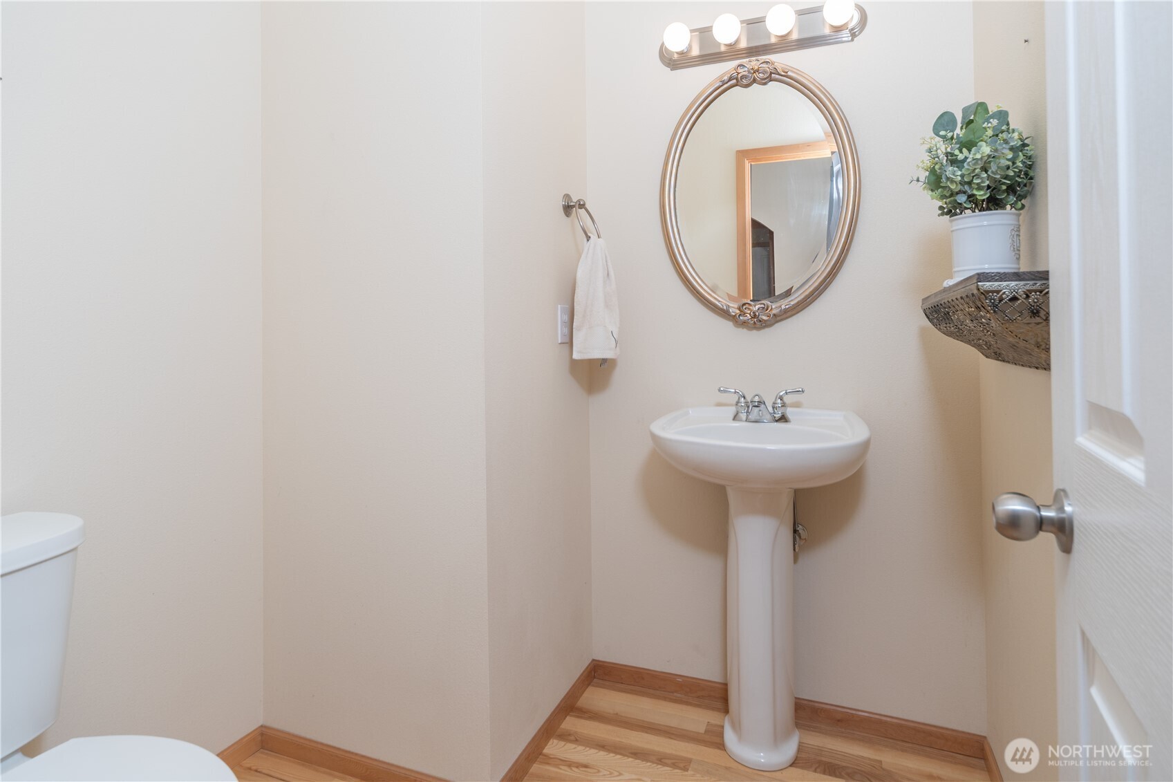 18130 Sunrise Ridge Avenue Northeast Poulsbo, WA 98370 - Photo 27 of 30 a bathroom with a sink toilet and a mirror