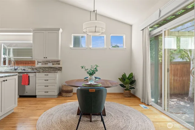 a view of a dining room with furniture and a fireplace