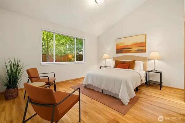 a spacious bathroom with a granite countertop sink mirror and a shower