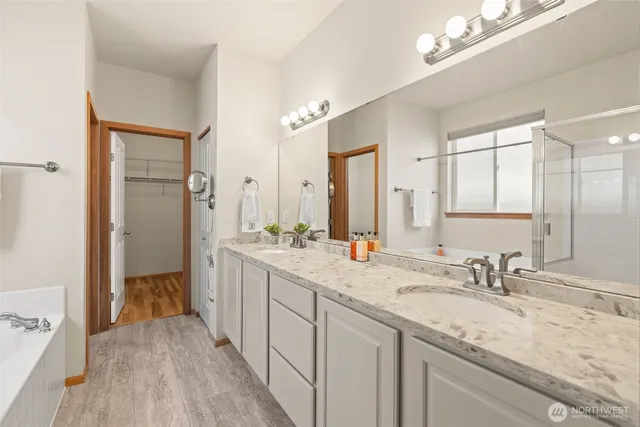 a bathroom with a bathtub and a shower