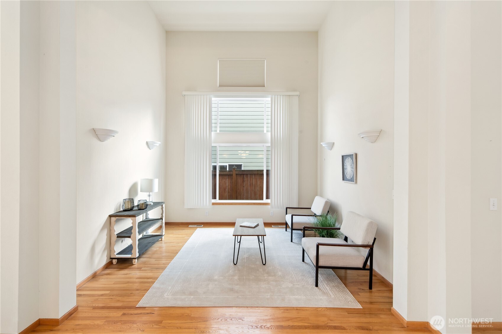 18130 Sunrise Ridge Avenue Northeast Poulsbo, WA 98370 - Photo 9 of 30 a living room with furniture and a large window