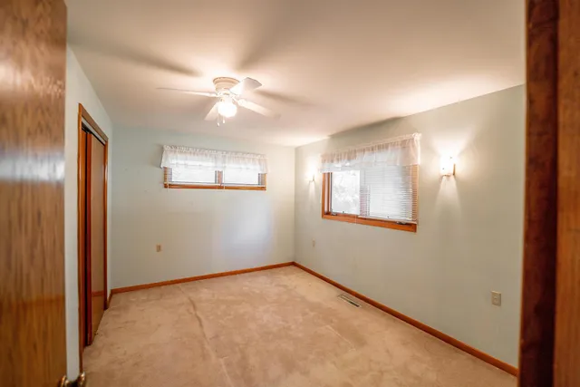 a kitchen that has a lot of cabinets and refrigerator