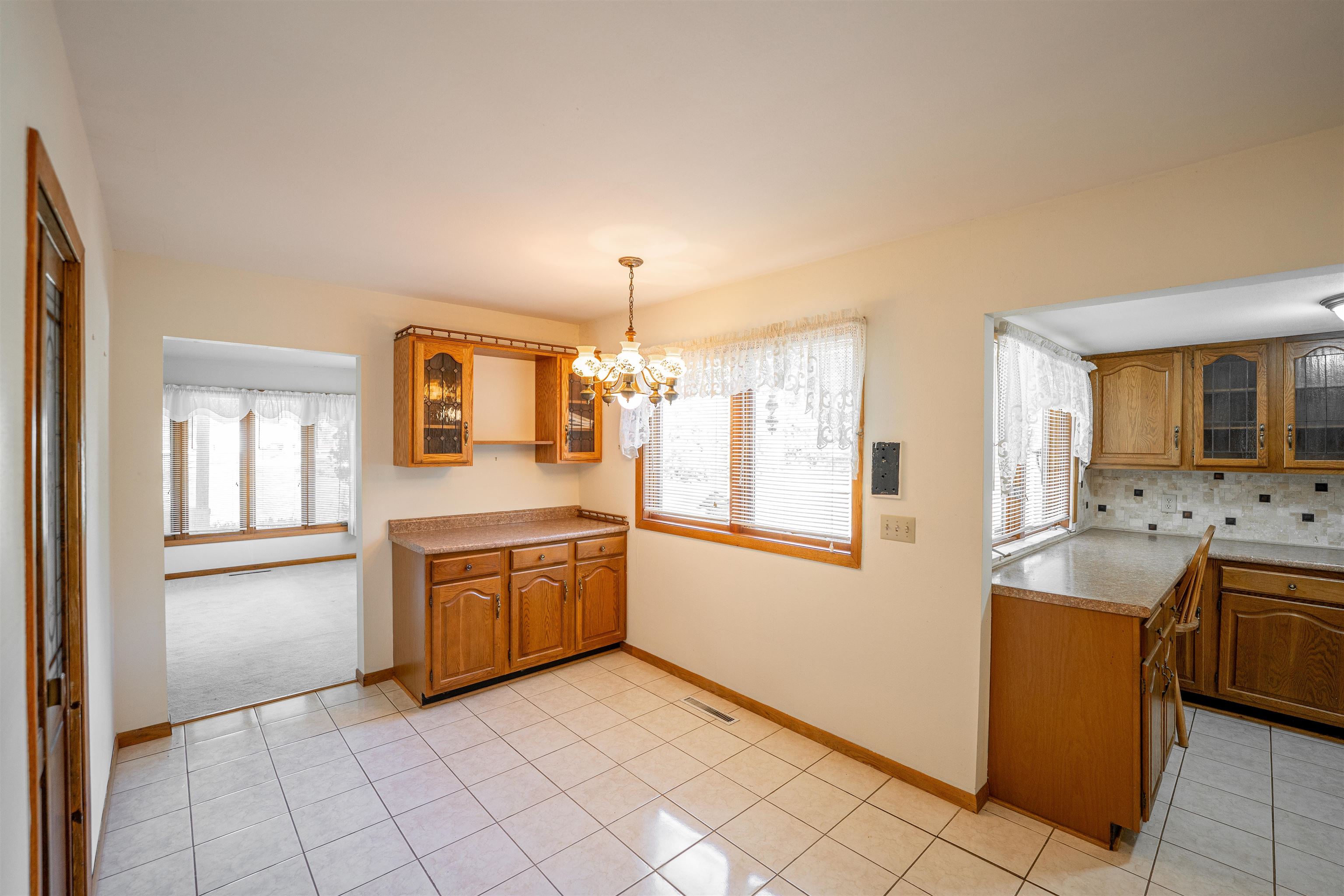 15361 South Bluff Road South Beloit, IL 61080 - Photo 15 of 64 a kitchen with stainless steel appliances granite countertop a stove a sink and a refrigerator