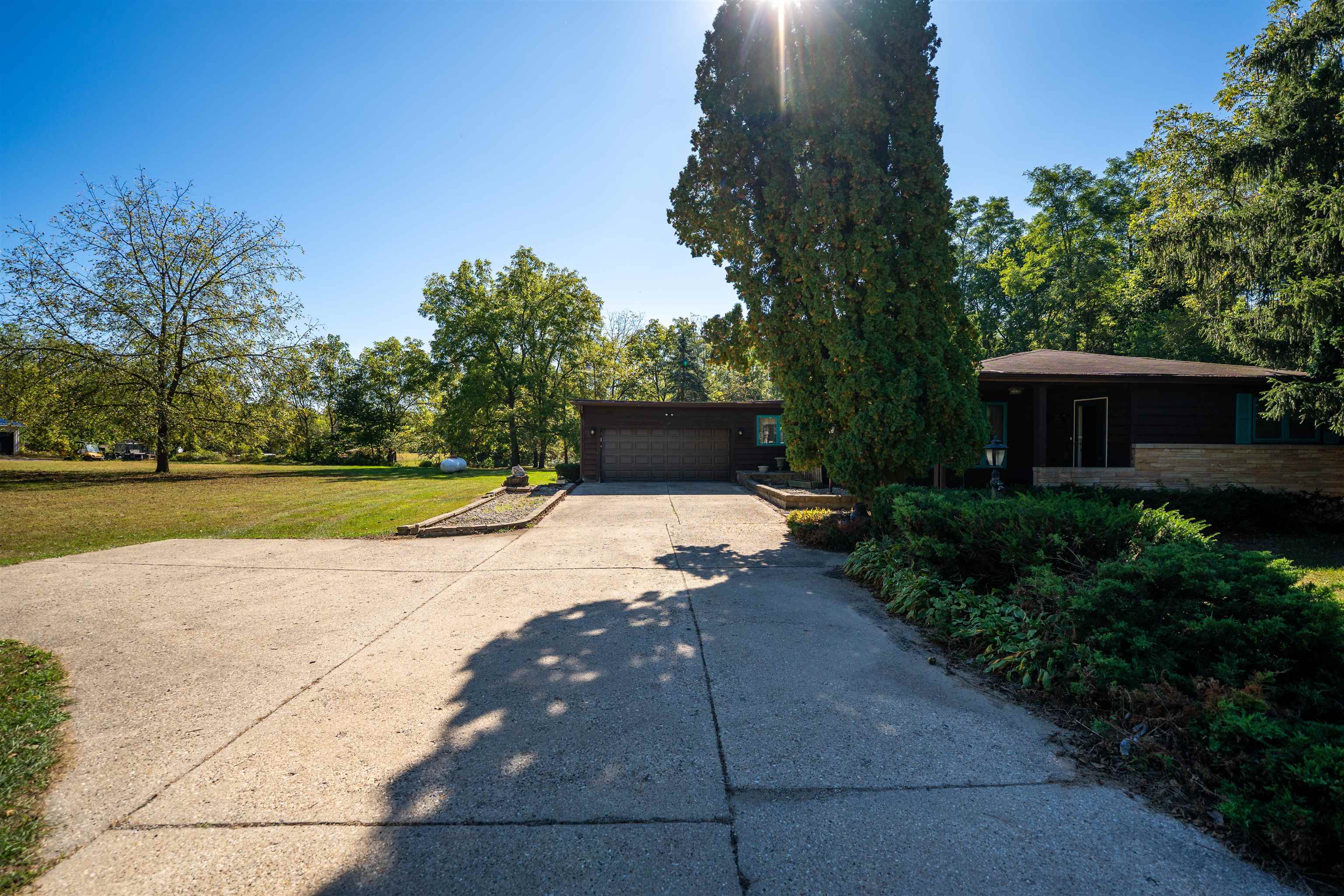 15361 South Bluff Road South Beloit, IL 61080 - Photo 2 of 64 a view of a house with backyard and garden