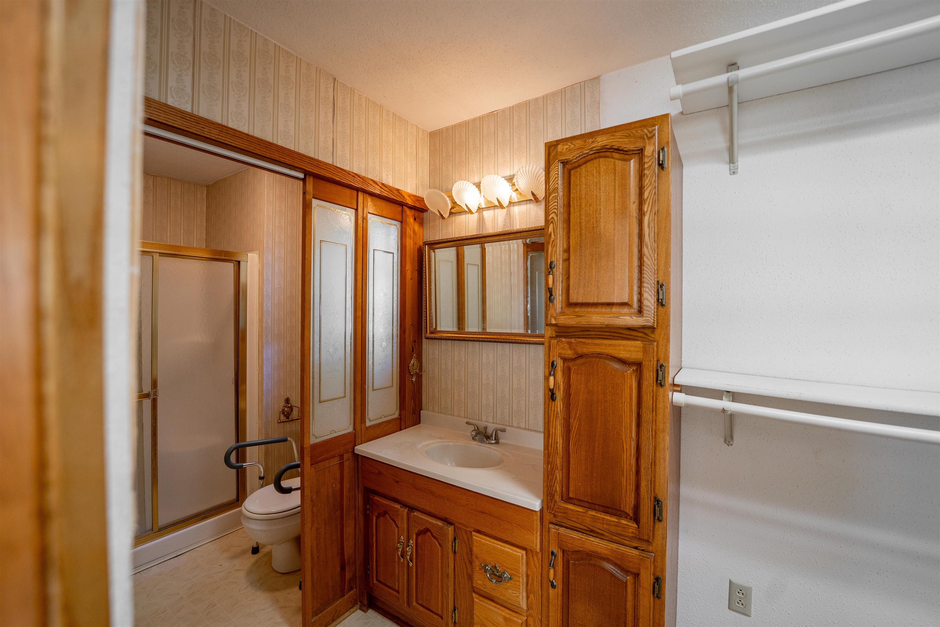 15361 South Bluff Road South Beloit, IL 61080 - Photo 24 of 64 a bathroom with a granite countertop sink toilet and shower