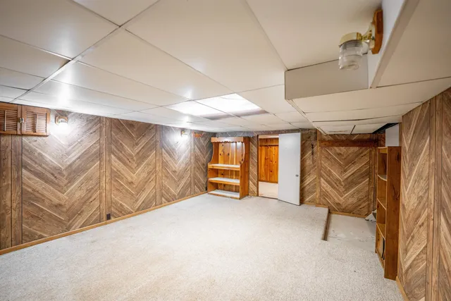 a view of a hallway with stairs