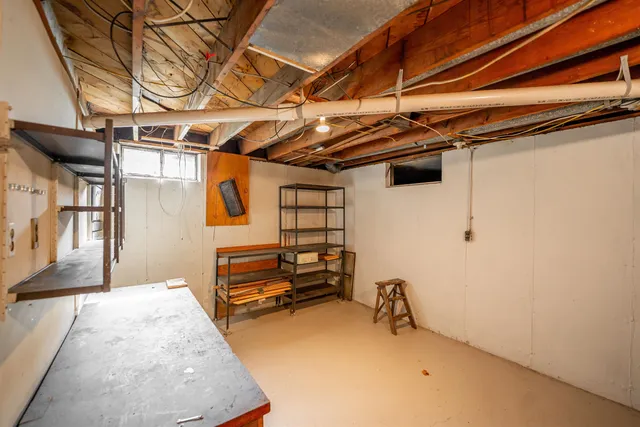 a view of a chair and table in the garden