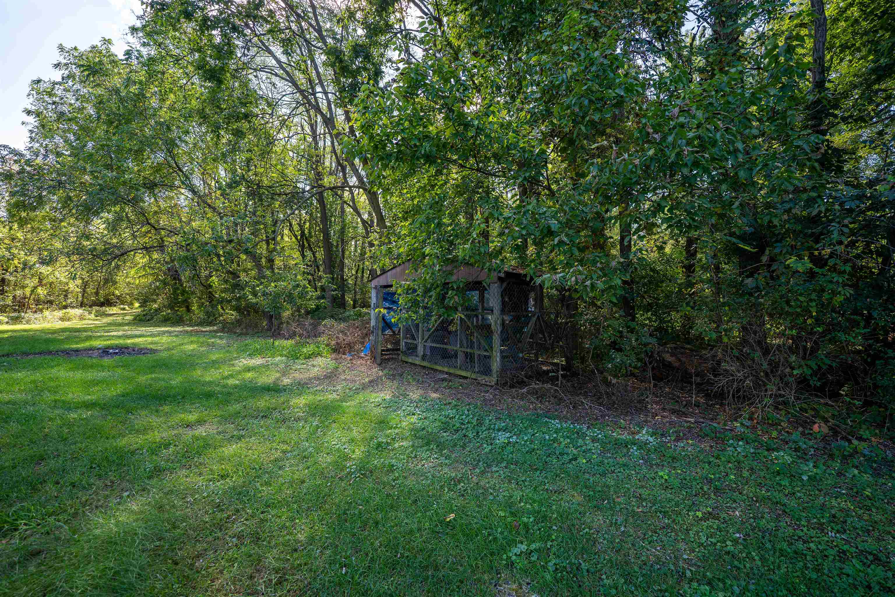 15361 South Bluff Road South Beloit, IL 61080 - Photo 42 of 64 a view of a chair and table in the garden
