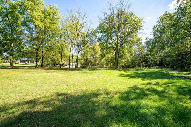 an aerial view of a houses with lake view