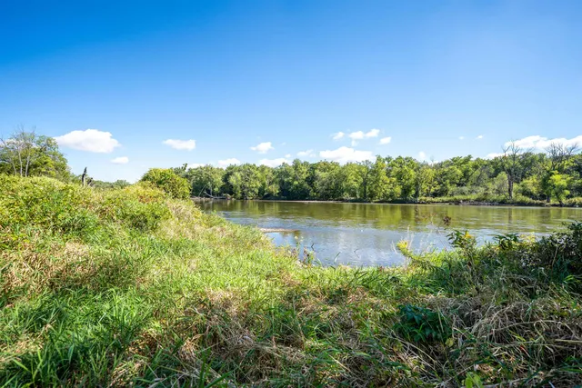 a view of a lake with houses in the background