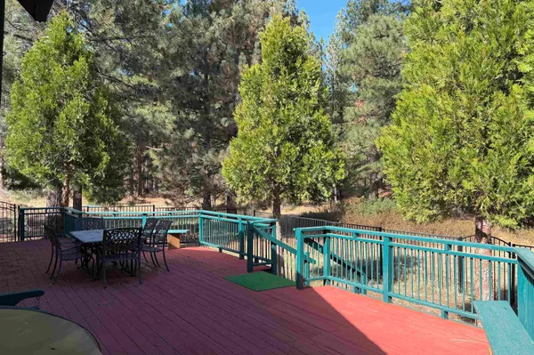 a front view of a house with yard and green space