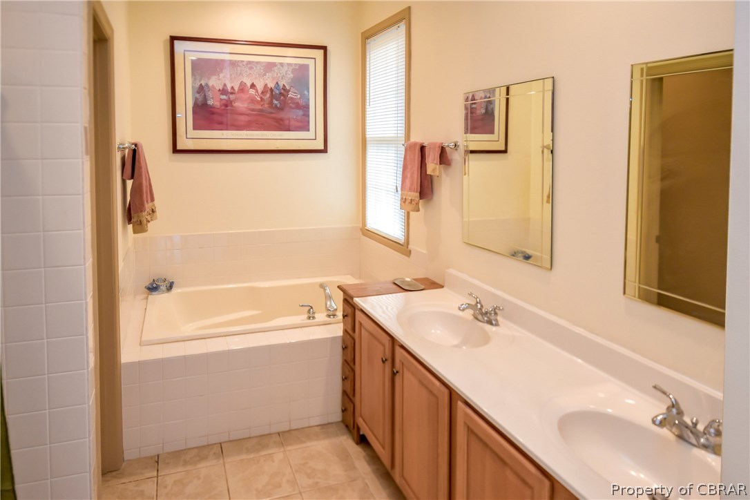 1374 Island Point Road Heathsville, VA 22473 - Photo 19 of 39 master Bath with double vanity, tub and walk in shower.