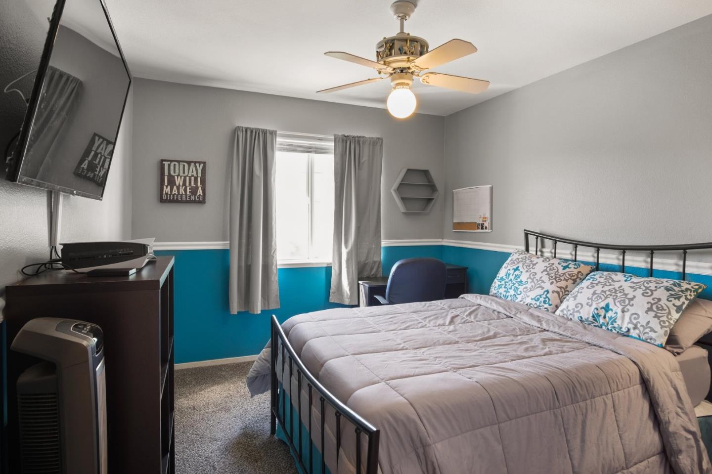 3021 Simms Lane Tracy, CA 95377 - Photo 11 of 33 a bedroom with a bed and a chandelier