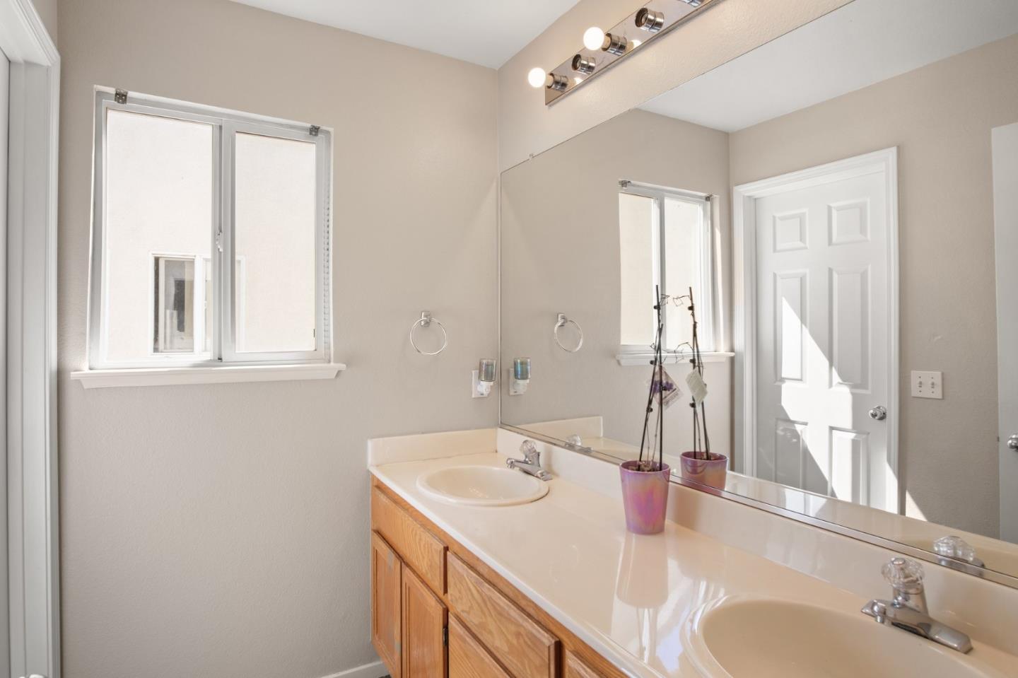 3021 Simms Lane Tracy, CA 95377 - Photo 12 of 33 a bathroom with a sink and a mirror