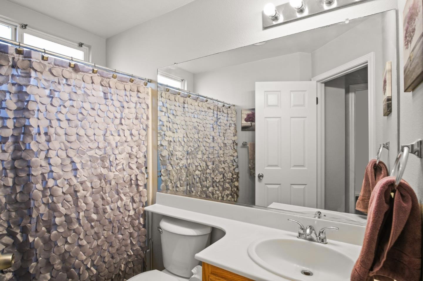3021 Simms Lane Tracy, CA 95377 - Photo 17 of 33 a bathroom with a sink toilet and shower