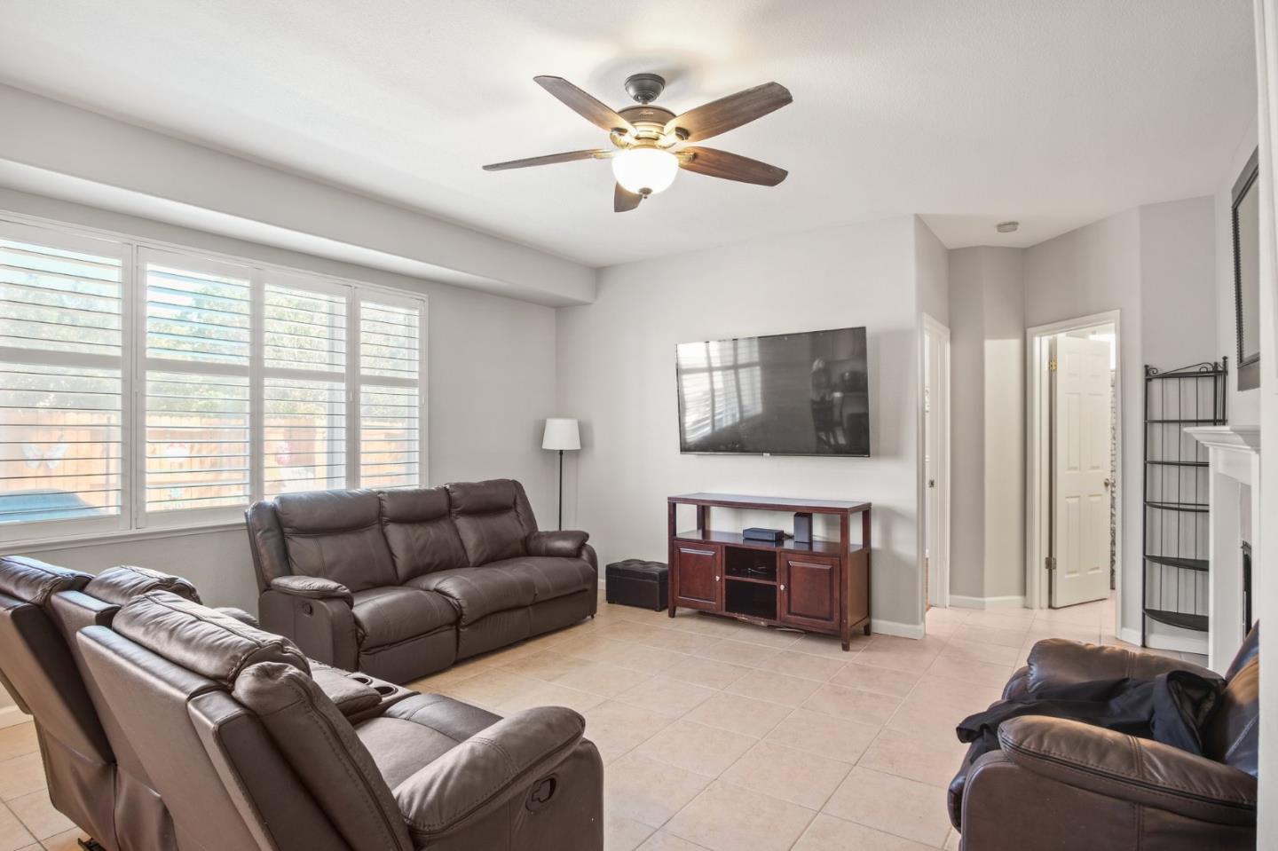 3021 Simms Lane Tracy, CA 95377 - Photo 19 of 33 a living room with furniture and a flat screen tv